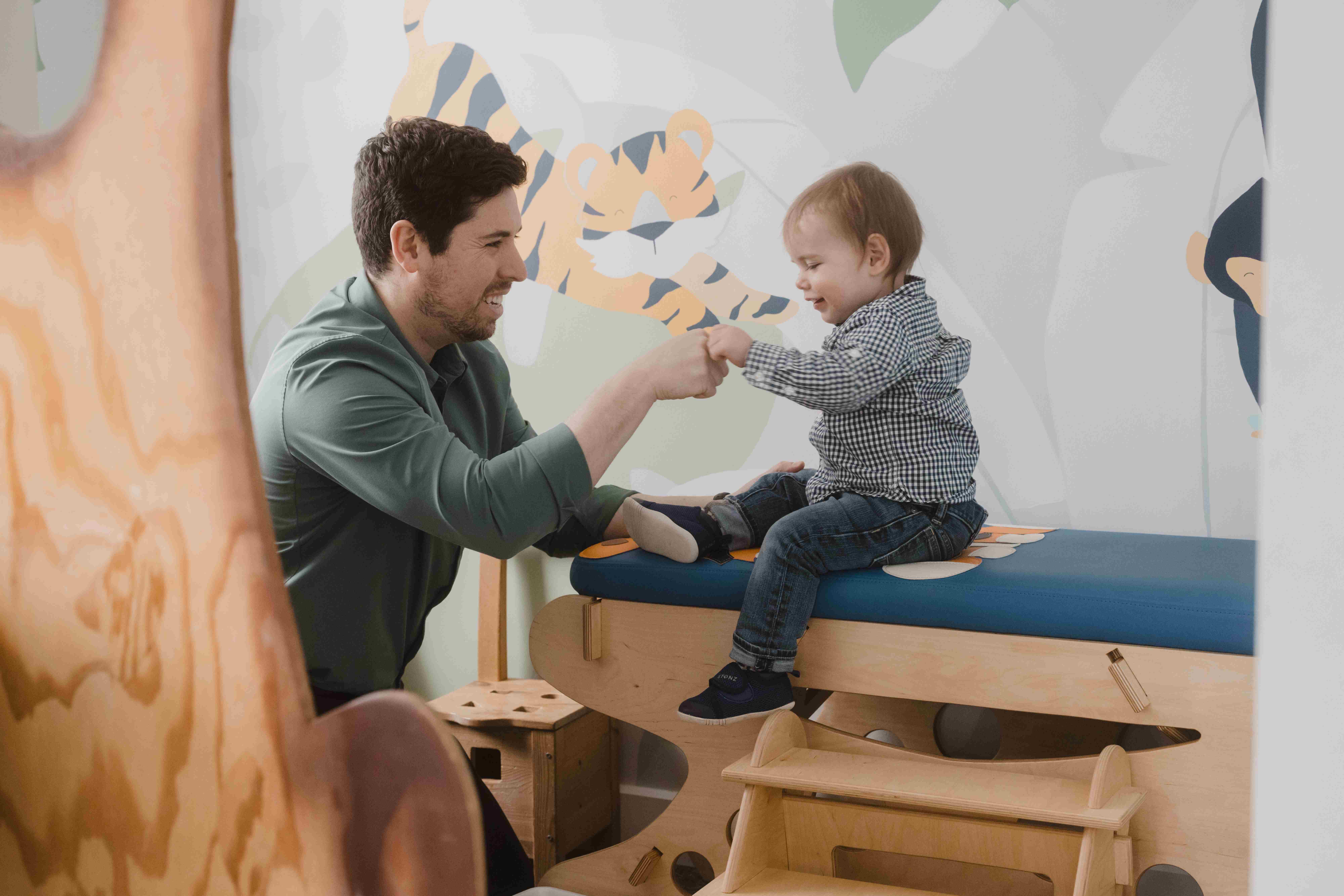 Dr. Ben interacting with a young child in the pediatric treatment area